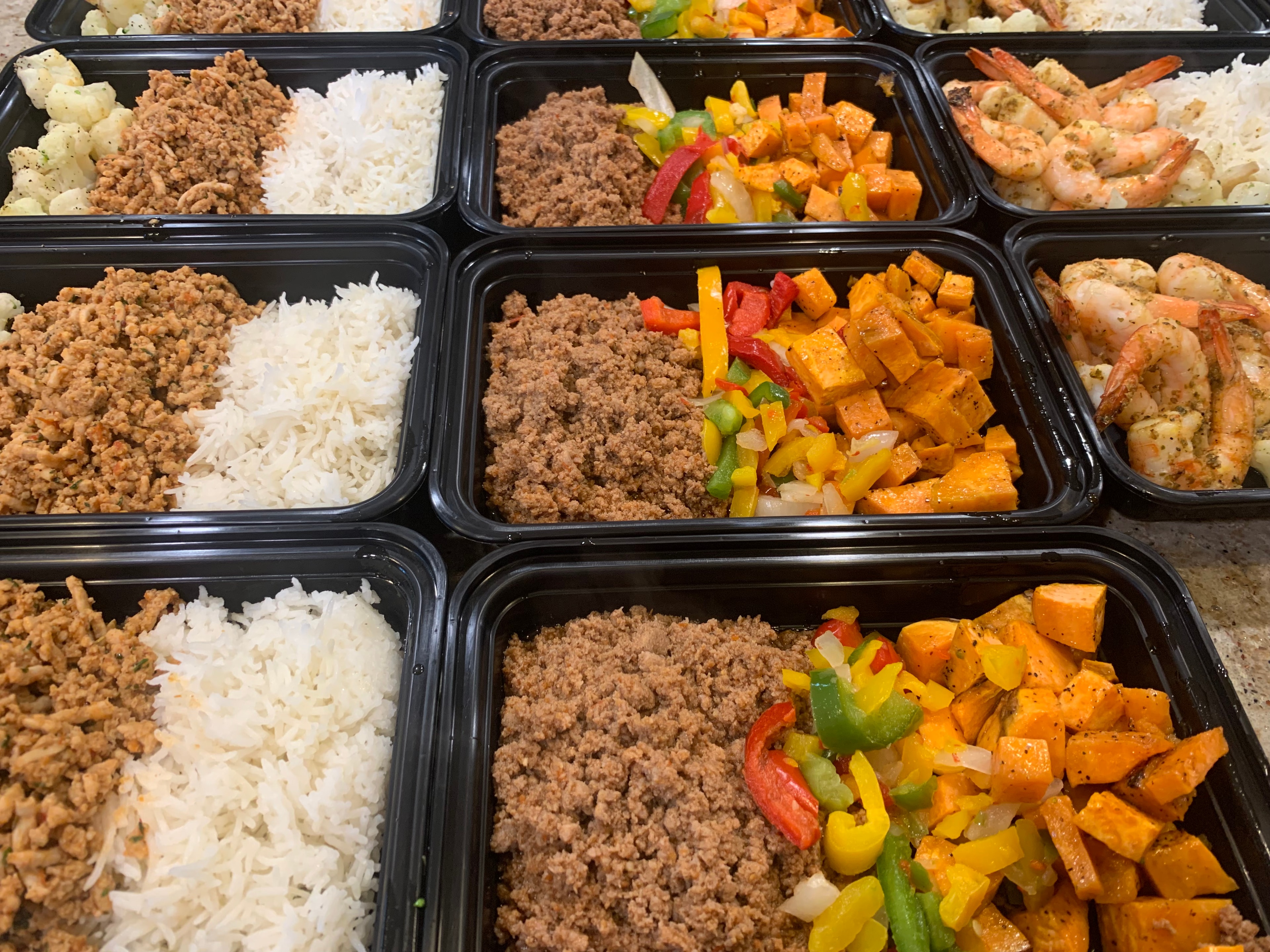 Turkey, seasoned beef, shrimp and sweet potato meal prep containers