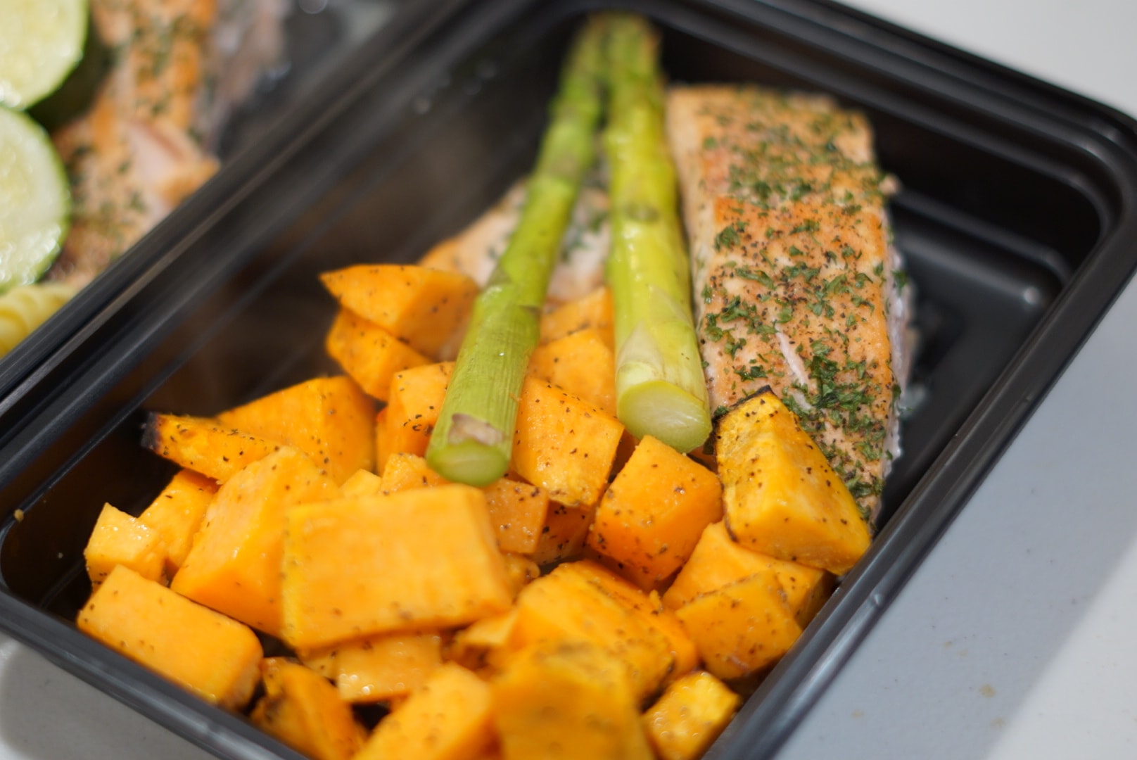 Salmon with sweet potato and asparagus meal prep container